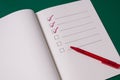 To-do list with several points. Open notebook on green background