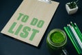 To Do List with stationery and a green smothie. Healthy break