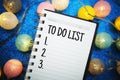 To Do List text on notepad to view on blue background Royalty Free Stock Photo