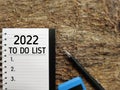 2022 TO DO LIST text written on notepad in vintage background. Stock photo. Royalty Free Stock Photo