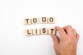 To do list. Wooden letters on a white background