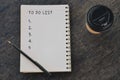 To Do List words written on on notepad with disposable coffee cup and pen. Royalty Free Stock Photo