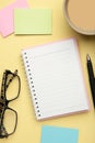 To do list written in a notebook. Notebook with an to do list on beige with cup of coffee and clock Royalty Free Stock Photo