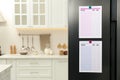 To do lists with magnets on refrigerator. Space for text Royalty Free Stock Photo