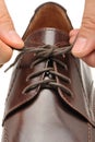 To fasten bootlace on shoes Royalty Free Stock Photo
