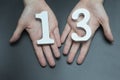 To female hands the number thirteen. Royalty Free Stock Photo