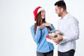 To give gifts. Young beautiful woman receiving a gift from her boyfriend. Royalty Free Stock Photo