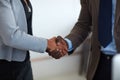 To joining companies and creating new partnerships. an unrecognizable businessman and businesswoman shaking hands in the Royalty Free Stock Photo