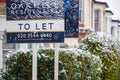 To Let sign covered by winter snow in London