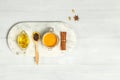 Spices for Golden milk. Ingredients for making a paste from turmeric powder, oil, black pepper and spices. Flat lay with space