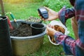 To measure soil pH, gardeners are using a monitor to measure pH balance, acidity, and alkalinity, use of modern agricultural tools