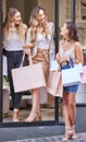 On to the next one. Full length shot of three attractive young women taking some time out to enjoy a shopping spree in Royalty Free Stock Photo