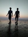 Two people photo.. In sunset point Beach Royalty Free Stock Photo