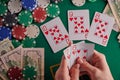 To a poker player in a casino, a combination in straight flush cards, a lot of money and chips Royalty Free Stock Photo