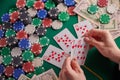 To a poker player in a casino, a combination in straight flush cards, a lot of money and chips Royalty Free Stock Photo