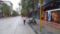Shenzhen, China: prevent and combat new coronavirus pneumonia, street view, a small number of pedestrians, all wearing masks, and Royalty Free Stock Photo