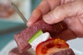 To put meat on a beef brochette Royalty Free Stock Photo