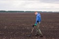 To seek treasures on earth with a metal detector Royalty Free Stock Photo