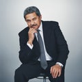 To succeed, you need to stay ten steps ahead. Studio portrait of a mature businessman posing against a grey background.