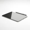 To the tablet is a metallic stylus also sleek in design suggesting functional Royalty Free Stock Photo