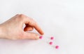 Tablets in hand on a white background close-up. Royalty Free Stock Photo