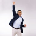 To win big, you sometimes have to take big risks. Studio shot of a handsome young man cheering against a grey background