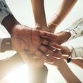 In it to win it. Closeup shot of a group of businesspeople joining their hands together in a huddle. Royalty Free Stock Photo