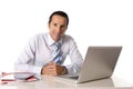 40 to 50 years old senior businessman working on computer at office desk looking confident and relaxed Royalty Free Stock Photo