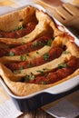 Toad in the hole in baking dish close up. vertical Royalty Free Stock Photo