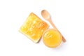 Toast with apricot jam, bowl and spoon isolated on background Royalty Free Stock Photo