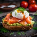Toast with avocado dip, salmon and poached egg, close up. Sandwich with guacamole, salmon slices and poached egg on dark rye bread