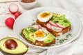 Toast with avocado, radish, egg and flax seeds Royalty Free Stock Photo