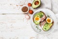 Toast with avocado, radish, egg and flax seeds Royalty Free Stock Photo