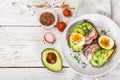 Toast with avocado, radish, egg and flax seeds Royalty Free Stock Photo