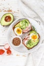 Toast with avocado, radish, egg and flax seeds Royalty Free Stock Photo