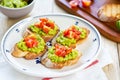 Crostini with avocado and tomato