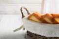 Toast bread in basket on white wooden table Royalty Free Stock Photo