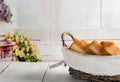 Toast bread in basket on white wooden table Royalty Free Stock Photo