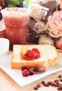 toast bread and sweet strawberry and berry jam in white dish beside cool choclolate on table top ready to eat Royalty Free Stock Photo