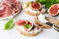 Toast or bruschetta with ricotta cheese, prosciutto and figs Royalty Free Stock Photo