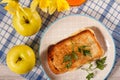 Toast with butter and cheese on white plate, two apples, glass o Royalty Free Stock Photo