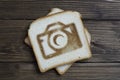 Toast with camera sign on dark wood