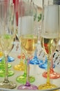 Coloured champagne glases prepare for a family party.