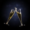 Toast champagne flutes with splash against a dark background, co Royalty Free Stock Photo