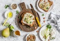 Toast with cheese, pear, honey and nuts. Delicious breakfast or snack on a light background Royalty Free Stock Photo