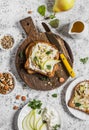 Toast with cheese, pear, honey and nuts. Delicious breakfast or snack on a light background Royalty Free Stock Photo