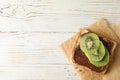 Toast with choco cream and kiwi on wooden background