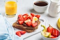 Toast with chocolate hazelnut spread,  banana and strawberries for breakfast. Breakfast food concept Royalty Free Stock Photo