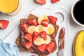 Toast with chocolate hazelnut spread,  banana and strawberries for breakfast. Breakfast food concept Royalty Free Stock Photo