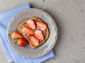 Toast with chocolate and strawberry, Single sandwich with chocolate cheese on white plate, top view Royalty Free Stock Photo